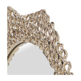 Close-up of the Libra Interiors Honeycomb cast aluminium wall mirror in gold, showing the pierced honeycomb frame edge and oval glass centre.