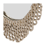 Close-up of the Libra Interiors Honeycomb cast aluminium wall mirror in gold, showing the openwork honeycomb frame texture against a white background.