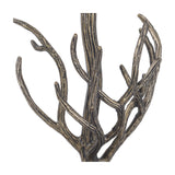 Close-up of the Libra Interiors Antiqued Brass Tiger Table Lamp showing the sculptural branching limbs with etched bark detail rising to the bulb fitting.