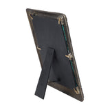 Rear view of Libra Interiors Etched Cast Aluminium Photo Frame in antique brass, showing black backing board, turn clips and fold-out easel strut.