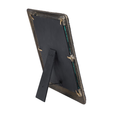 Rear view of Libra Interiors Etched Cast Aluminium Photo Frame in antique brass, showing black backing board, turn clips and fold-out easel strut.