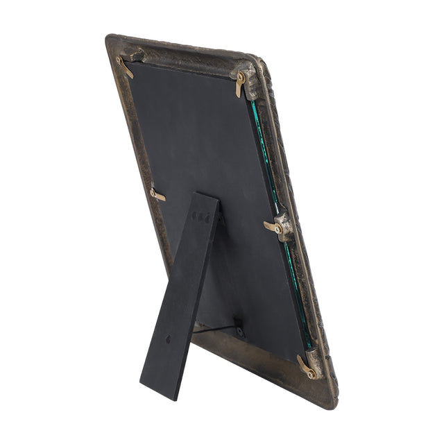 Rear view of Libra Interiors Etched Cast Aluminium Photo Frame in antique brass, showing black backing board, turn clips and fold-out easel strut.