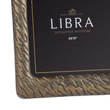 Close-up of the Libra Interiors Etched Cast Aluminium 8x10" Photo Frame corner, showing tiger-stripe etched texture in antique brass and gold.