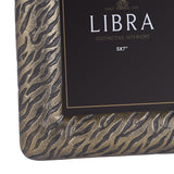 Close-up of Libra Interiors Etched Tiger cast aluminium 5x7" photo frame corner, showing antique brass finish with tiger-stripe etched texture.