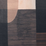 Close-up of Libra Interiors Textured Geometric Framed Canvas Wall Art showing overlapping charcoal, walnut and cream shapes with a subtly textured matt finish.