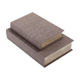 Libra Interiors Linen Weave book-style storage boxes in greige with textured weave finish and trimmed page-effect edges, stacked on a white background.