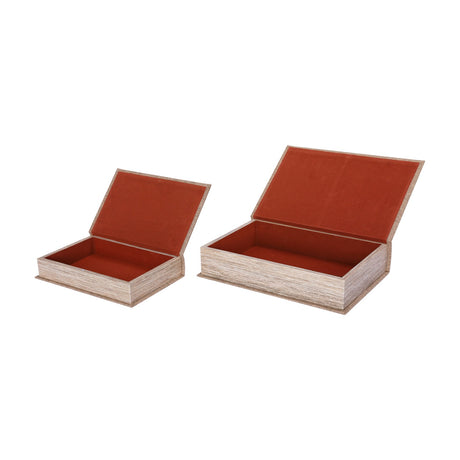Libra Interiors Linen Weave book-shaped storage box set of two in beige with rust velvet-lined interiors and hinged lids open, on a white background.