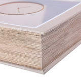 Close-up corner detail of the Libra Interiors canvas book-style storage box in grey, showing the wood base, canvas-wrapped cover and clock motif.