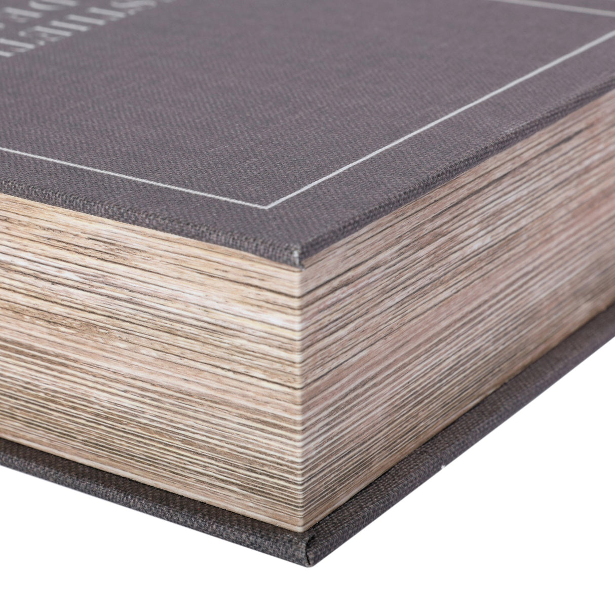 Close-up corner detail of the Libra Interiors Linen Book-Style Storage Box in grey, showing the linen-effect canvas cover and layered faux page edges.