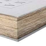 Close-up corner detail of the Libra Interiors Linen Book-Style Storage Box in white, showing pale grey linen binding and textured wood-effect page edges.