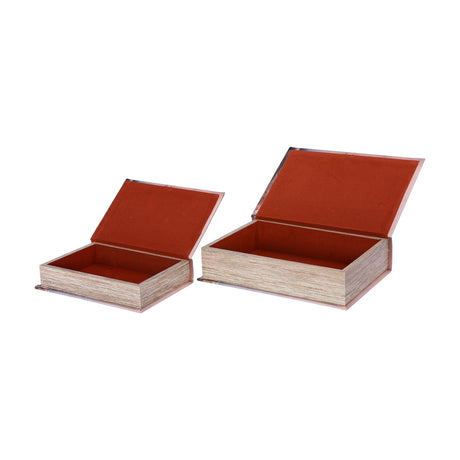 Libra Interiors Faux Leather Book Storage Boxes shown open as a set of two, revealing rust velvet-lined interiors with hinged lids on a white background.
