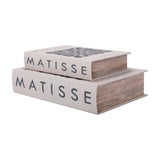Libra Interiors Linen Book-Style Storage Boxes in white with charcoal Matisse typography, stacked with the smaller box atop the larger on a white background.