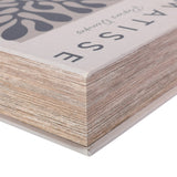 Close-up of the Libra Interiors Linen Book-Style Storage Box in white, showing the linen-wrapped edge, typographic Matisse title and layered pages detail.