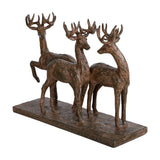 Libra Interiors Textured Trio of Stags Sculpture in brown, three antlered figures on a rectangular plinth with a weathered rustic finish.