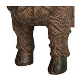 Close-up of the lower legs and hooves on Libra Interiors Rustic Textured Highland Cow Sculpture in brown resin, showing grooved shaggy coat detail.