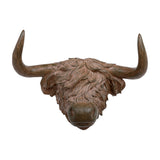 Libra Interiors Rustic Highland Cow resin wall art in brown, shown head-on with sweeping horns and shaggy textured coat on a white background.
