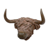 Libra Interiors Rustic Highland Cow resin wall art in brown, shown head-on with shaggy textured coat and sweeping horns against a plain white background.