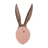 Rear view of Libra Interiors Rustic Weathered Hare Head resin wall art in brown, showing the smooth pink-toned back with keyhole fixing.