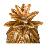 Close-up of the Libra Interiors Glazed Ceramic Pineapple Sculpture crown showing textured brown and gold reactive glaze on the spiky leaves.