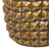 Close-up of the Libra Interiors Glazed Ceramic Pineapple Sculpture showing the crosshatched brown and gold reactive glaze texture across its rounded body.