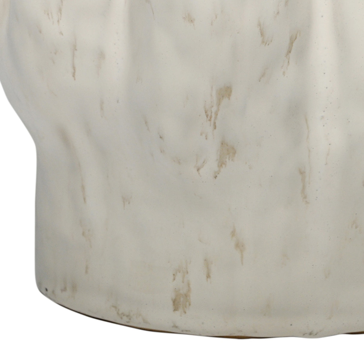 Close-up of the lower section of the Libra Interiors Ruffled Ceramic Wavy Vase in cream, showing the glossy reactive glaze with soft golden-brown speckling.