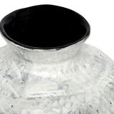Close-up of the Libra Interiors Textured Glaze Wash ceramic vase showing the flared neck, mottled white exterior and contrasting dark glazed interior.