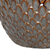 Close-up of the Libra Interiors Scale-Textured Ceramic Planter showing the glossy overlapping scale pattern in graded amber and charcoal grey tones.
