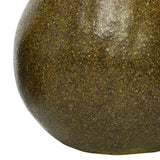 Close-up of the Libra Interiors Speckled Ceramic Pear Sculpture in green, showing the rounded body with a life-like speckled green and brown glaze.