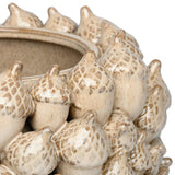 Close-up of Libra Interiors Textured Acorn ceramic planter in cream, showing sculptural acorn motifs with cross-hatched caps and reactive glaze finish.