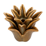 Libra Interiors Petal Reactive Glaze ceramic candle holder in mottled brown, with sculptural layered petals around a central well, on a white background.