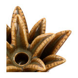 Close-up of Libra Interiors Petal Reactive Glaze ceramic candle holder in brown, showing sculpted petals rising around the central well for a tapered candle.