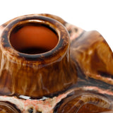 Close-up of Libra Interiors Reactive Glaze Ceramic Wavy Small Vase in brown, showing the glossy amber and terracotta rim around a slim opening.