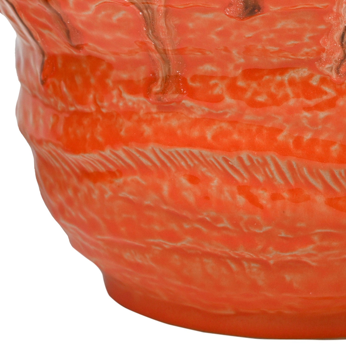 Close-up of Libra Interiors Reactive Glaze Ceramic Planter in orange, showing the textured ridged body and glossy drip glaze with amber and brown tones.