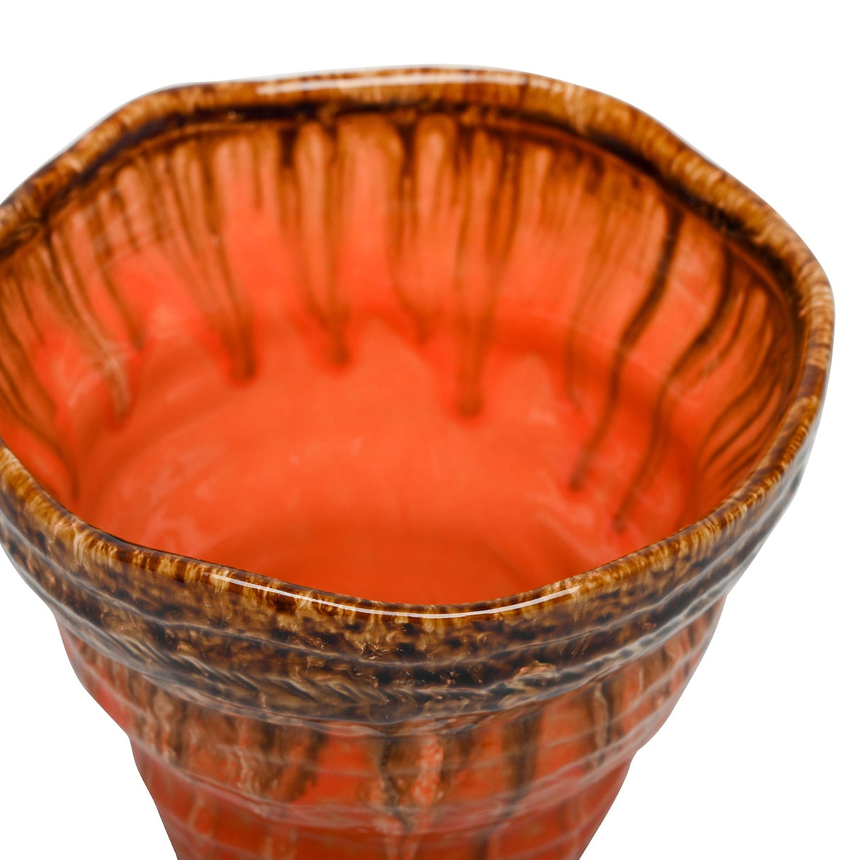 Close-up of Libra Interiors Reactive Glaze Ceramic Planter showing the wavy brown rim with dark glaze drips running into the glossy orange interior.