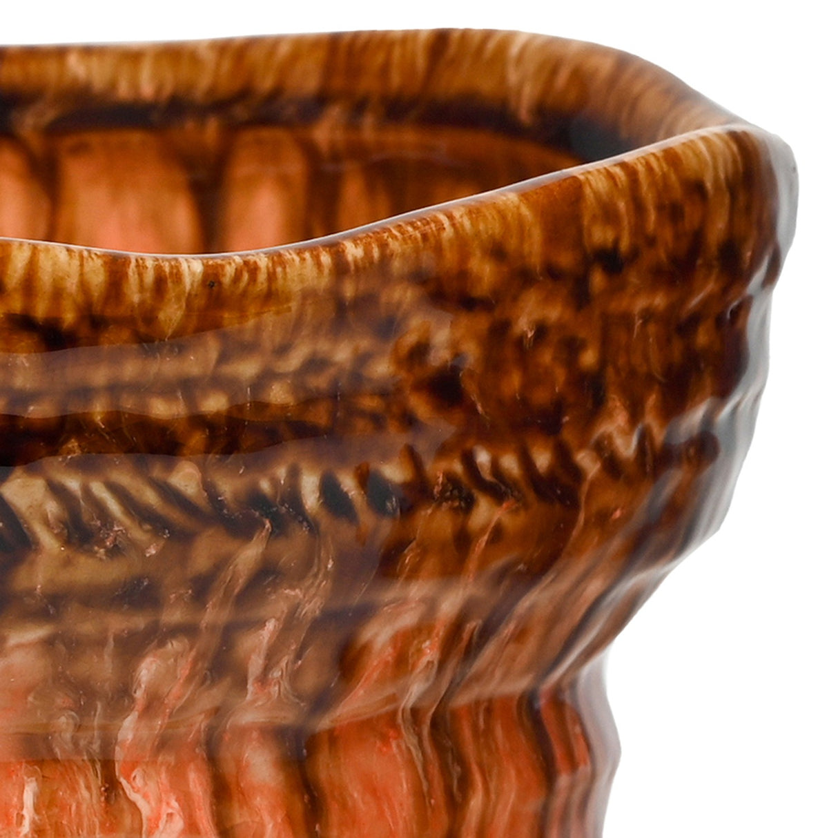 Close-up of the Libra Interiors Reactive Glaze Ceramic Planter showing the wavy rim, rippled body and glossy brown-to-orange drip glaze.