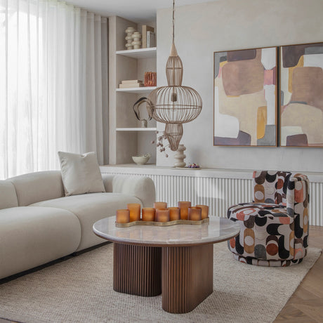 Libra Interiors Wire Frame Burnished Brass Pendant Light with three-tier caged silhouette above a marble coffee table in a neutral living room.
