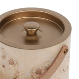 Close-up of the Libra Interiors burlwood veneer ice bucket showing the burnished brass lid with shaped knob and tan leather handle on brass fixings.
