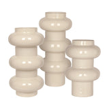Libra Interiors Tiered Enamel Iron Vase in cream, grouped trio of sculptural vases with stacked rounded tiers and glossy finish on a white background.
