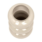 Top-down view of the Libra Interiors Tiered Enamel Iron Vase in cream, showing its stacked rounded form and narrow opening on a white background.