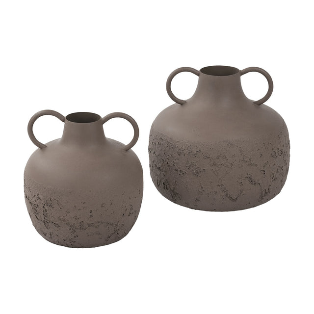 Libra Interiors Textured Two-Tone Handled Metal Vases in brown, pair of rounded urn-shaped iron vessels with looped handles and rustic base, on white.