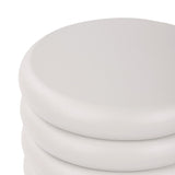 Close-up of the domed top and upper ribbed bands of the Libra Interiors Ribbed Iron Sculptural Side Table in cream with a matte textured finish.