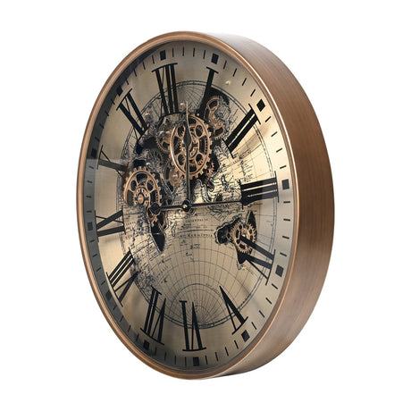 Libra Interiors Moving Cogs World Map wall clock in antique gold, angled view showing Roman numerals, exposed turning cogs and sepia map under glass.