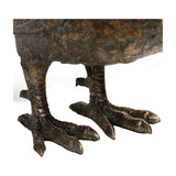 Close-up of the Libra Interiors Textured Antique Gold Pheasant Sculpture's clawed feet, showing detailed resin feather texture and metallic gold finish.