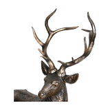 Close-up of Libra Interiors Textured Bronze Standing Stag Sculpture showing the head and full sweep of antlers in a warm textured bronze finish.