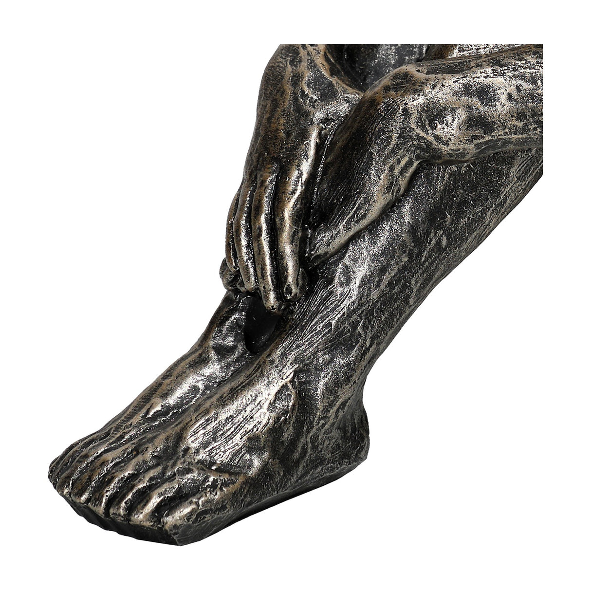 Close-up of the folded arm, hand and foot on the Libra Interiors Textured Resin Seated Male Sculpture in antique gold.