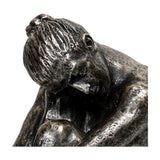 Close-up of the Libra Interiors Textured Resin Seated Female Sculpture in antique gold, showing the head resting on bent knees with textured hair detail.