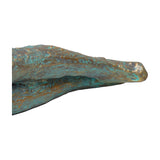 Close-up of the Libra Interiors Reading Woman resin sculpture showing the elongated head and textured verdigris antique gold and blue patina finish.