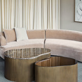 Libra Interiors Marble & Glass nesting coffee tables with organic shapes, brown Emperador marble and tinted glass tops on burnished gold corrugated bases.