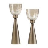 Libra Interiors Hammered Glass Smoke Gold Hurricane Lanterns in two heights, with tapered iron bases and copper-lustre glass cups on a white background.