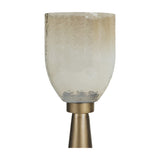 Libra Interiors Tapered Iron Hammered Glass Floor Lantern in gold with copper lustre hammered glass vessel on a smoke gold tapered iron base.